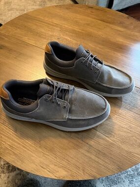 Skechers Men’s Gray Slip-On Style Loafers with Brown Heel Tab